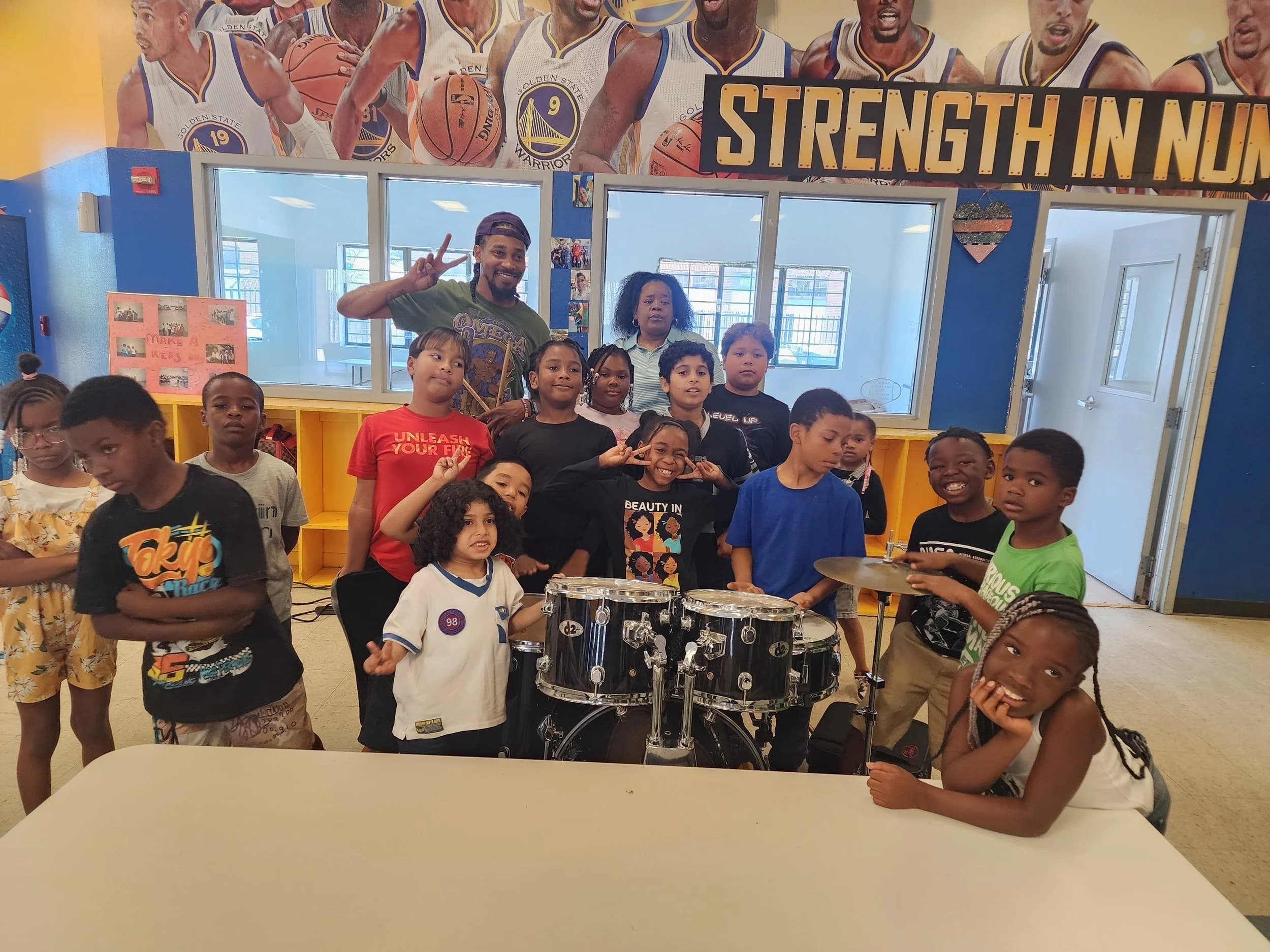 Kids learning to play drums and other instruments